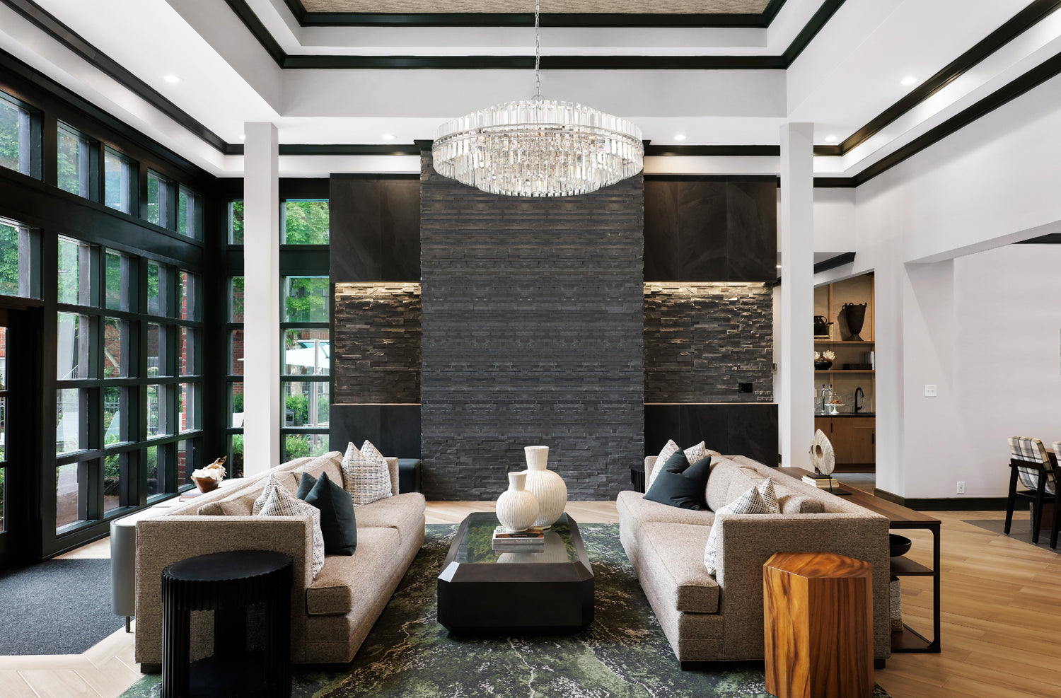 A Modern Crystal Chandelier showcased as a statement piece in a modern style living room.