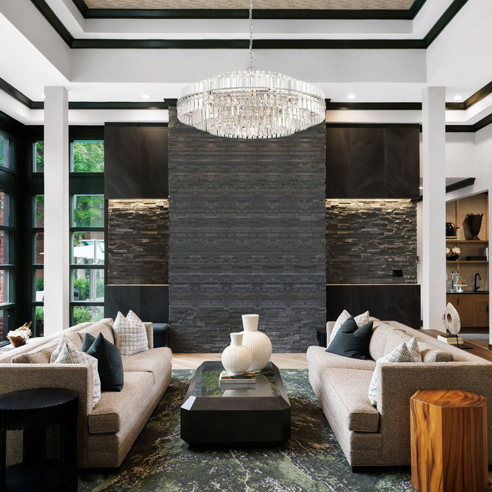 A Modern Crystal Chandelier showcased as a statement piece in a modern style living room.