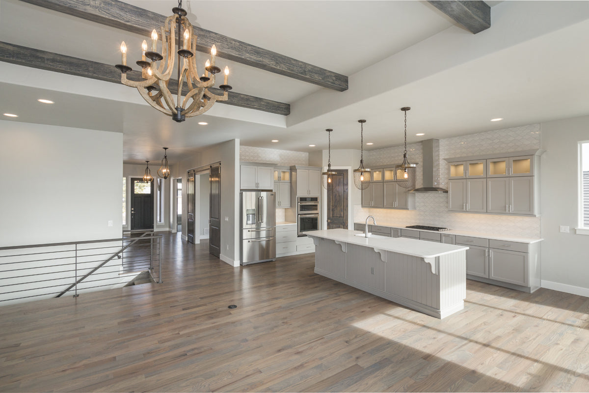 Lighting fixtures showcases in a remodeled kitchen and dining area.