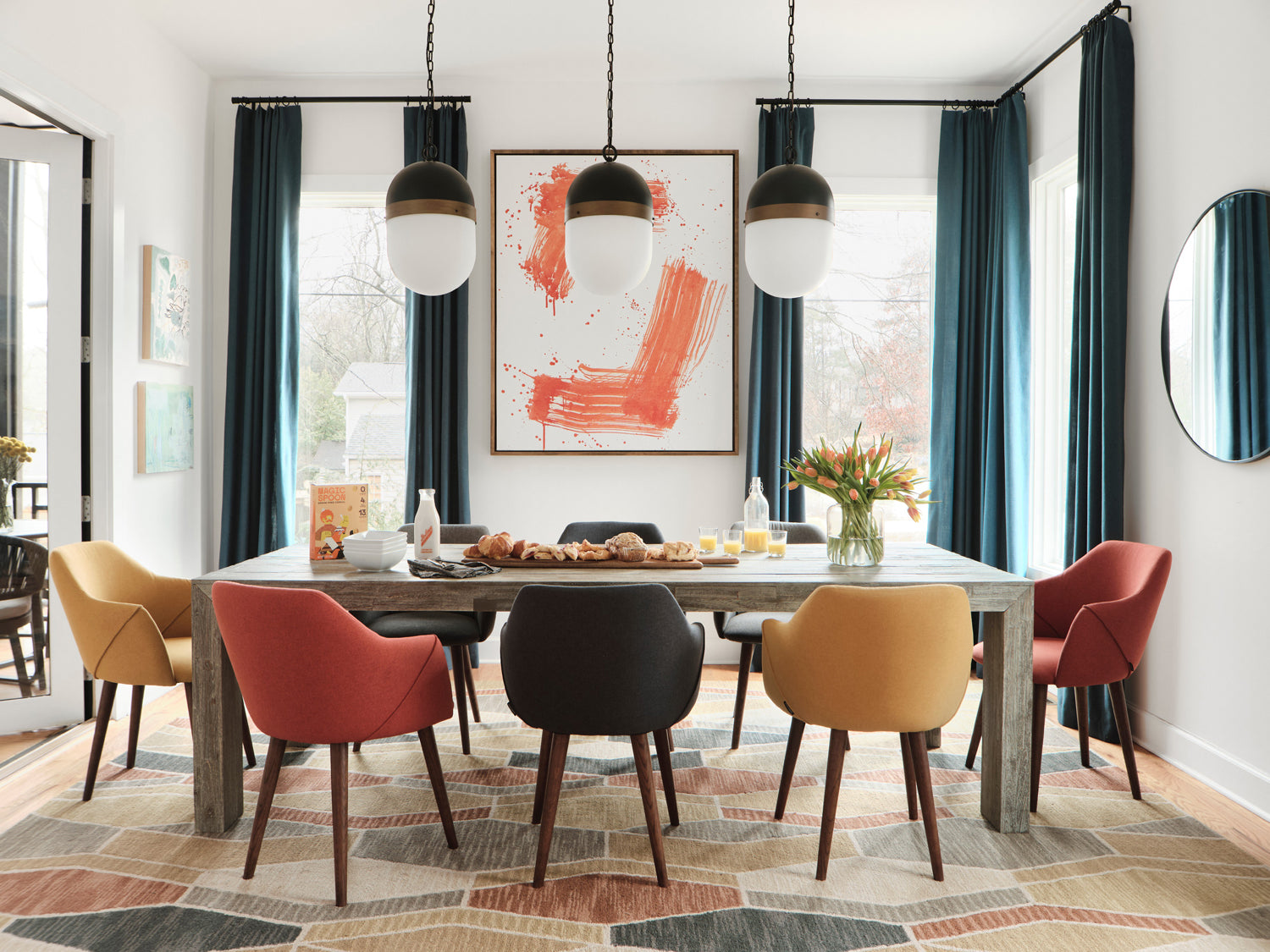 A series of Pendant Lights showcased above a Mid-Century Modern style Dining Room.