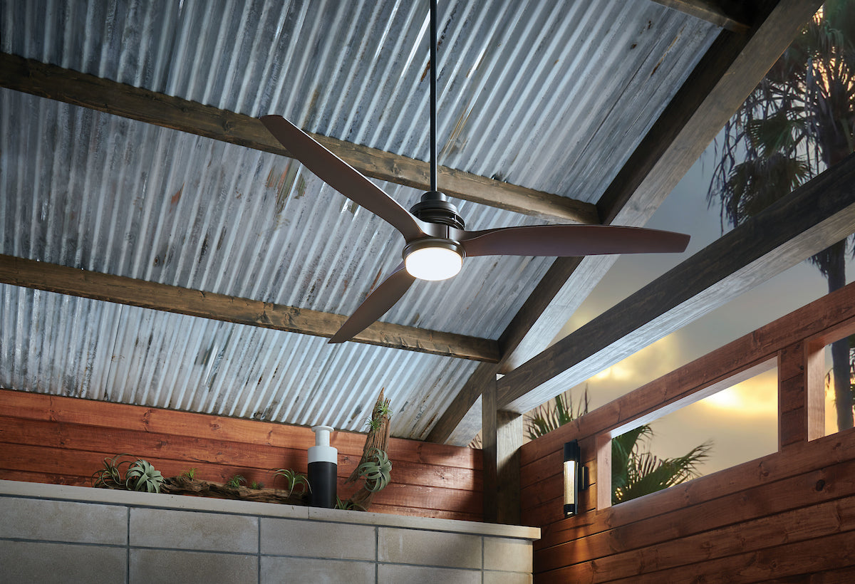 A modern style Outdoor Ceiling Fan, from Hinkley, showcased in a covered patio setting.