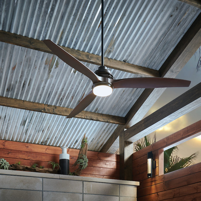 A modern style Outdoor Ceiling Fan, from Hinkley, showcased in a covered patio setting.