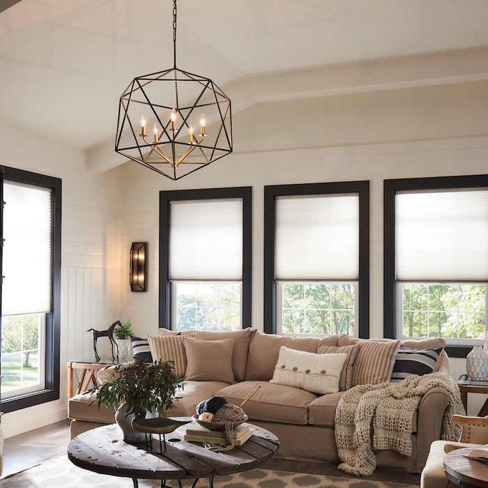 A showcase of a geometric chandelier in a living room setting.