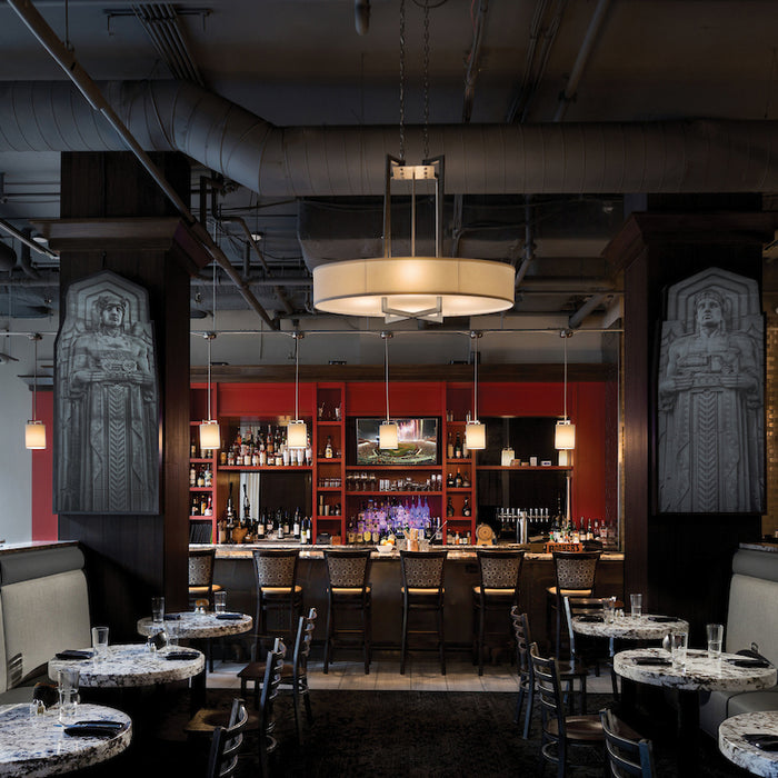 Hinkley lighting fixtures showcased in a restaurant and bar.
