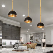 Landry 1 Light 10" Pendant in Matte Black + Rubbed Brass in a room setting