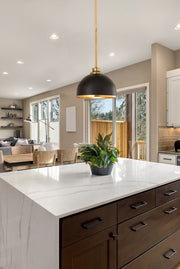 Landry 1 Light 10" Pendant in Matte Black + Rubbed Brass in a room setting