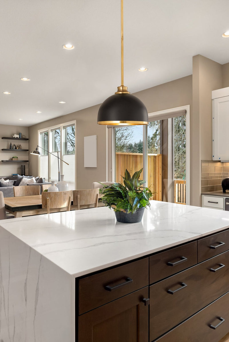 Landry 1 Light 10" Pendant in Matte Black + Rubbed Brass in a room setting
