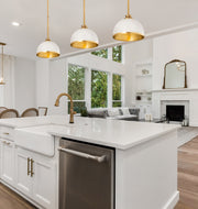 Landry 1 Light 10" Pendant in Matte White + Rubbed Brass in a room setting
