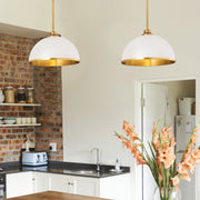 Landry 1 Light 14" Pendant in Matte White + Rubbed Brass in a room setting