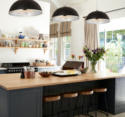 Landry 1 Light 20" Pendant in Matte Black + Chrome in a room setting
