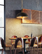 Landry 1 Light 20" Pendant in Matte Black + Rubbed Brass in a room setting