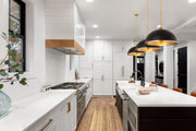 Landry 1 Light 20" Pendant in Matte Black + Rubbed Brass in a room setting