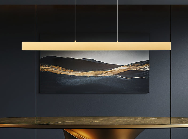 Hudson 1 Light 55" Linear Pendant in Gold in a room setting