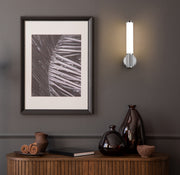 Solange 1 Light 4.75" Wall Sconce in Chrome in a room setting