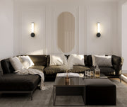 Solange 1 Light 4.75" Wall Sconce in Matte Black in a room setting
