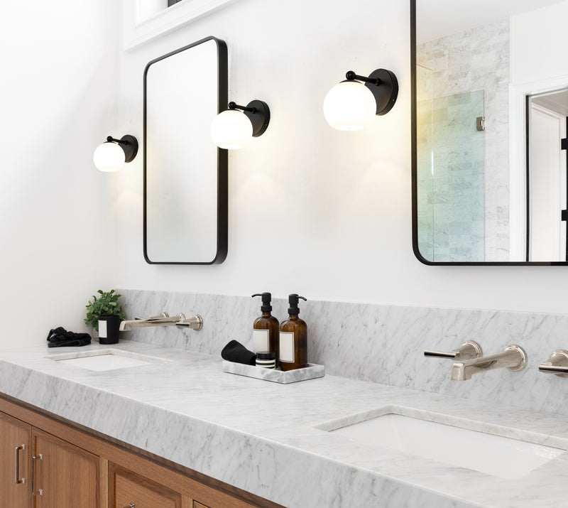Neoma 1 Light 5.25" Wall Sconce in Matte Black in a room setting