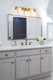 Analia 4 Light 36" Vanity in Modern Gold in a room setting