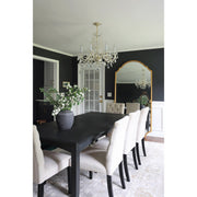 Traditional Crystal 8 Light 26" Chandelier in Polished Brass in a room setting