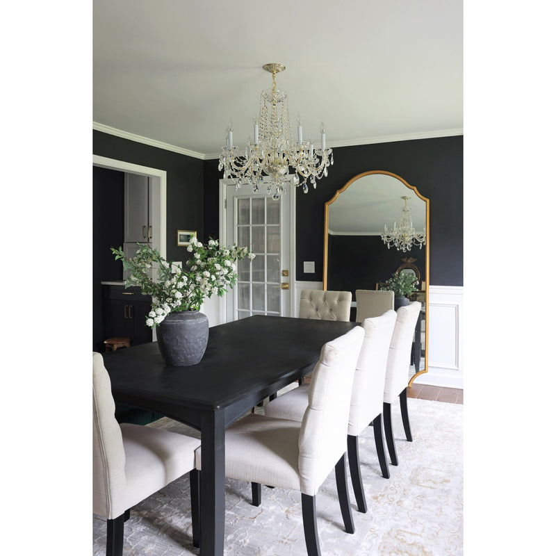 Traditional Crystal 8 Light 26" Chandelier in Polished Brass in a room setting