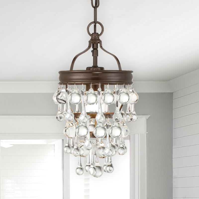 Calypso 1 Light 7.25" Pendant in Vibrant Bronze in a room setting