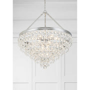 Calypso 8 Light 25" Pendant in Polished Chrome in a room setting