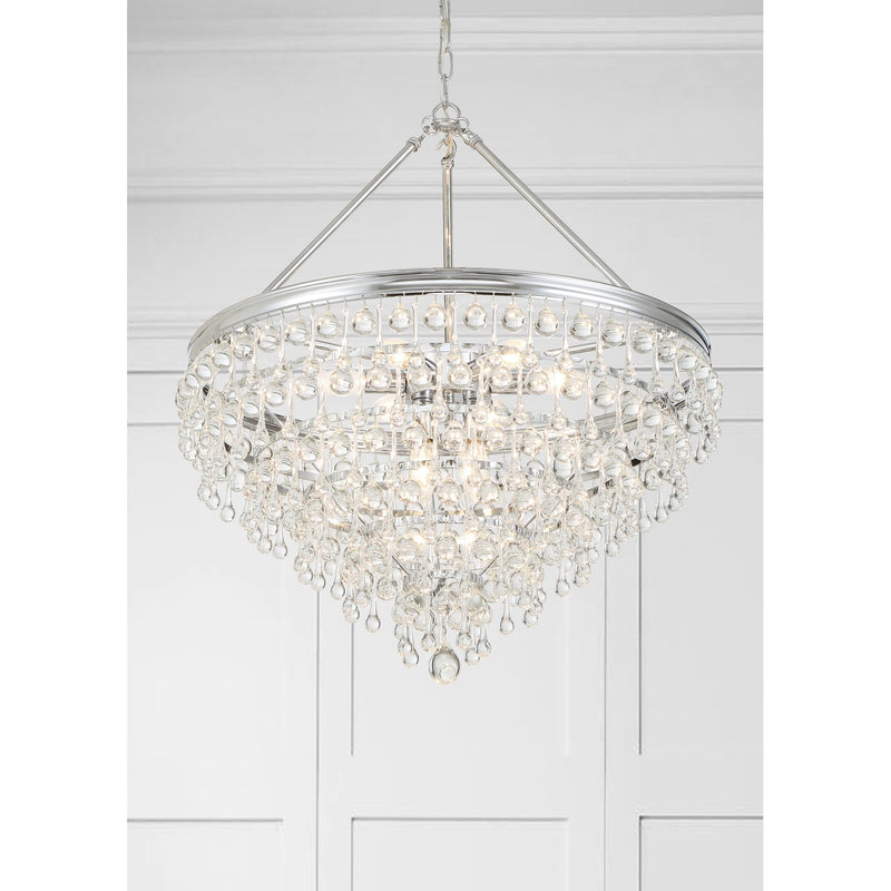 Calypso 8 Light 25" Pendant in Polished Chrome in a room setting