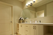Tidal 4 Light 33.25" Vanity in Brushed Nickel in a room setting