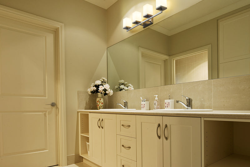 Tidal 4 Light 33.25" Vanity in Brushed Nickel in a room setting