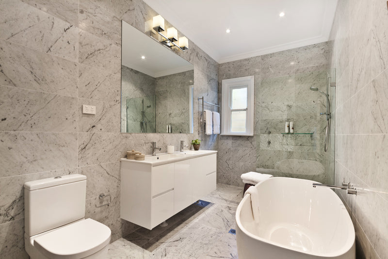 Tidal 3 Light 23.25" Vanity in Chrome in a room setting