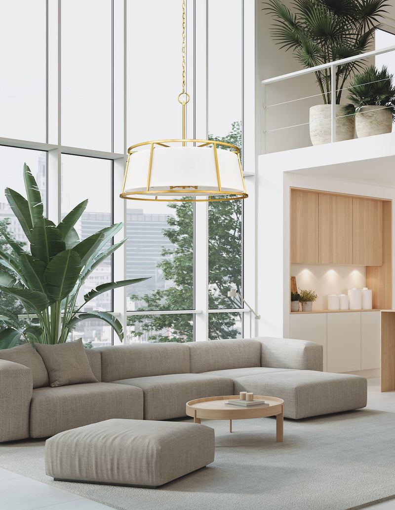 Lenyx Pendant 8 Light 32" Chandelier in Rubbed Brass in a room setting