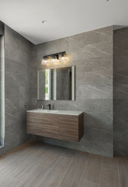 Astor 3 Light 23" Vanity, Clear Shade in Matte Black in a room setting