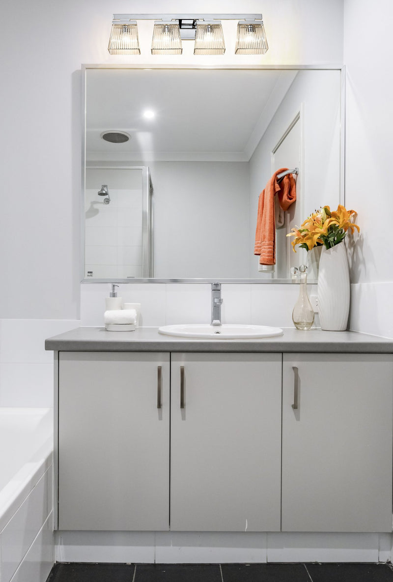 Astor 4 Light 29" Vanity, Clear Shade in Chrome in a room setting