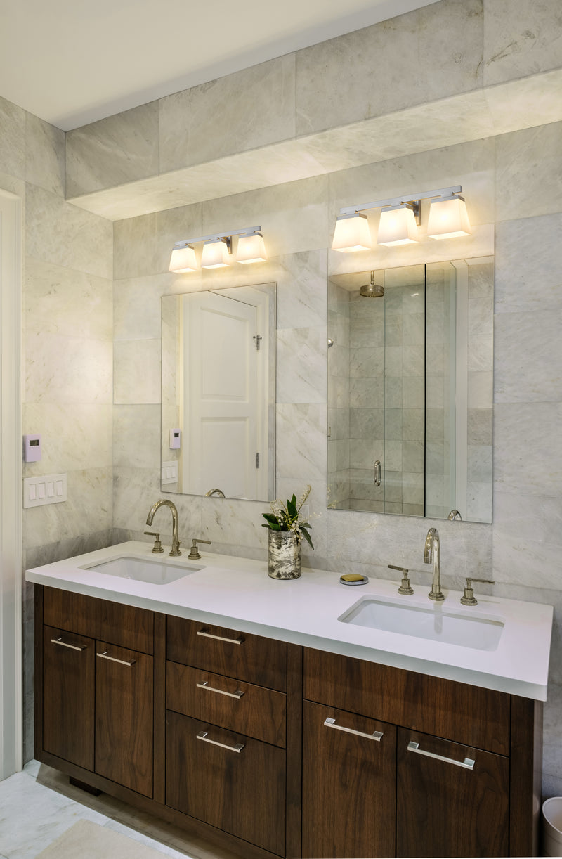 Astor 3 Light 23" Vanity, Etched Opal Shade in Brushed Nickel in a room setting