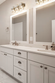 Bennington 3 Light 22.25" Vanity in Brushed Nickel in a room setting