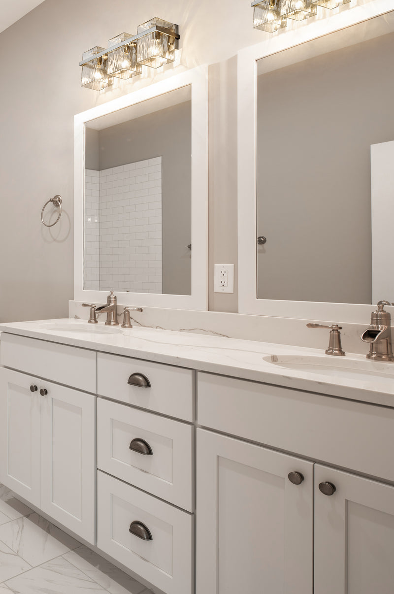 Bennington 3 Light 22.25" Vanity in Brushed Nickel in a room setting