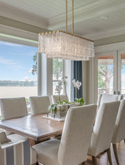 Glacier 5 Light 42.75" Linear Pendant in Modern Gold in a room setting
