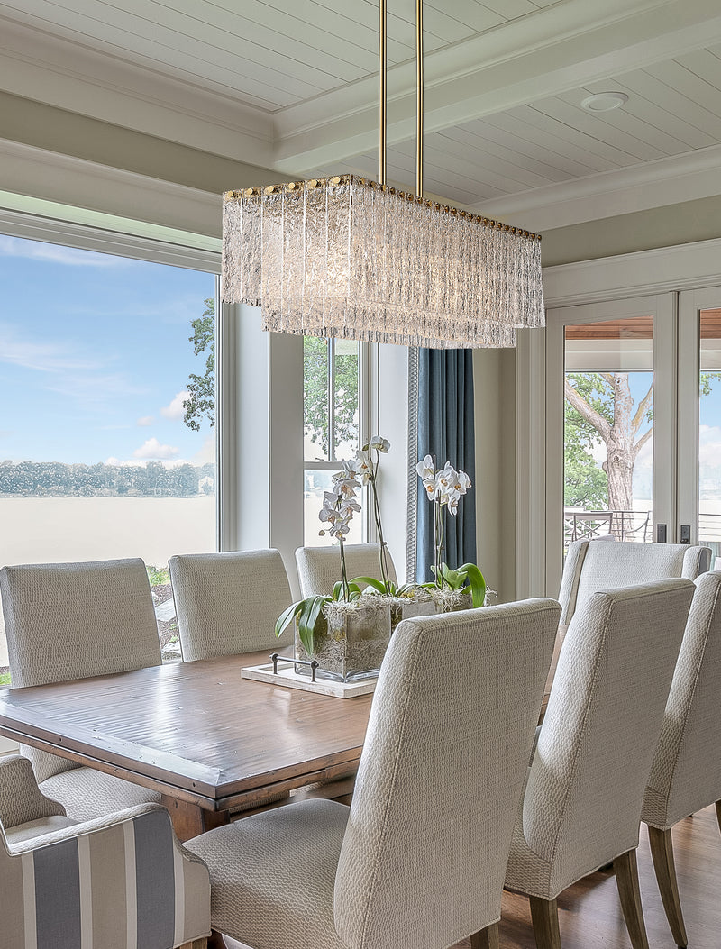 Glacier 5 Light 42.75" Linear Pendant in Modern Gold in a room setting