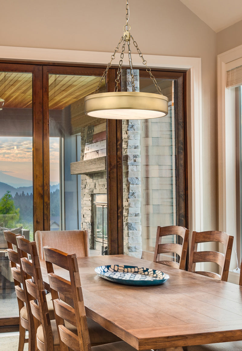 Anders 3 Light 22" Pendant in Rubbed Brass in a room setting