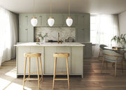 Gideon 1 Light 10" Pendant in Modern Gold in a room setting