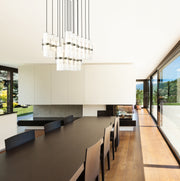 Cayden 17 Light 42" Linear Pendant in Brushed Nickel in a room setting