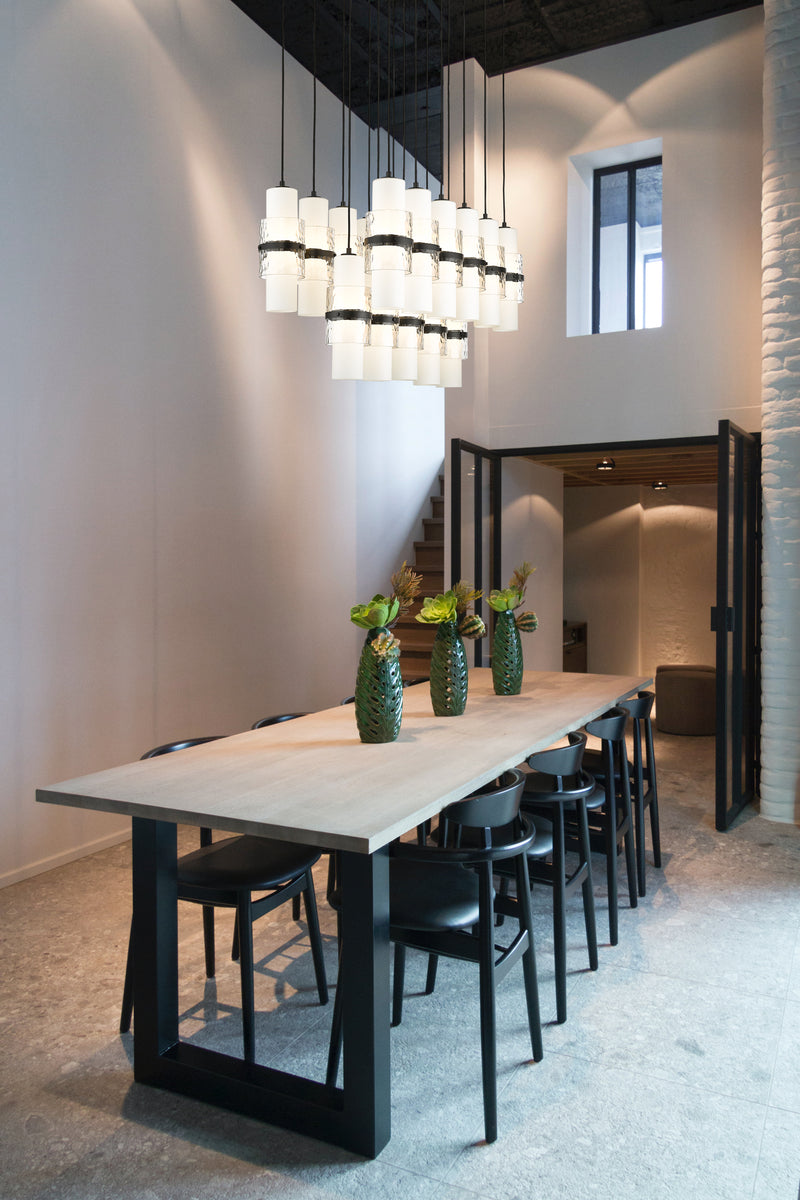 Cayden 17 Light 42" Linear Pendant in Matte Black in a room setting