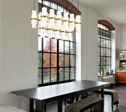 Cayden 17 Light 42" Linear Pendant in Modern Gold in a room setting