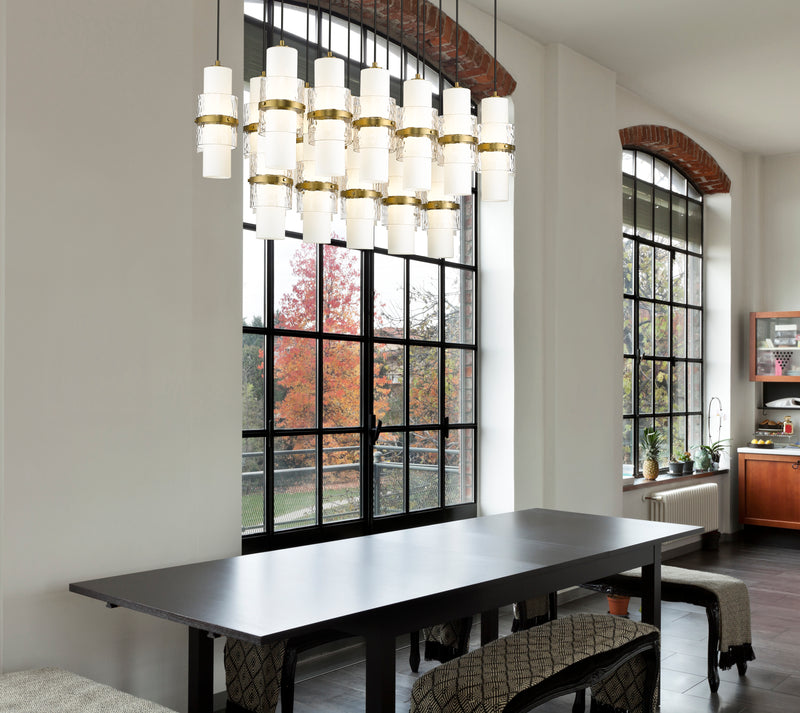 Cayden 17 Light 42" Linear Pendant in Modern Gold in a room setting