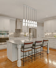 Cayden 7 Light 54" Linear Pendant in Brushed Nickel in a room setting