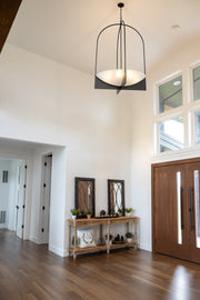 Devon 8 Light 32" Pendant in Matte Black in a room setting