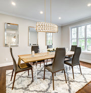Harden 10 Light 43" Linear Pendant in Modern Gold in a room setting