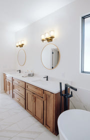 Grayson 3 Light 23" Vanity in Modern Gold in a room setting