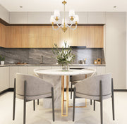 Katerina 5 Light 24" Chandelier in Rubbed Brass in a room setting