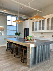 Rialto 6 Light 32" Pendant in Signature Gold in a room setting