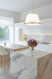 Madeline 6 Light 24" Pendant in Modern Gold in a room setting